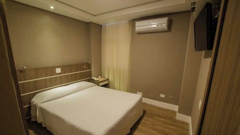 Drift off comfortably in a calm room with cooling air-conditioning.