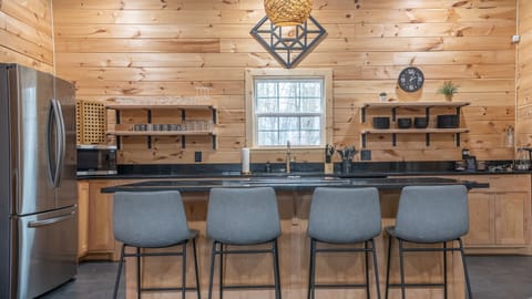 Spacious kitchen with island seating, perfect for cooking and gathering