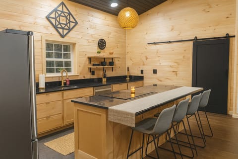 Fully equipped chef’s kitchen with island seating and modern finishes