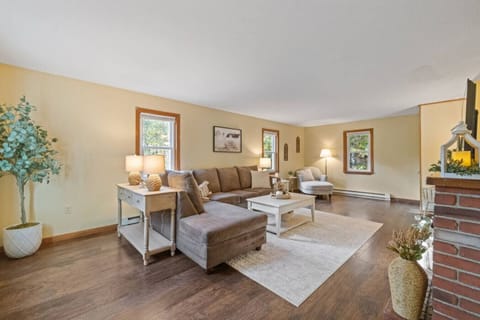Bright, spacious living area with large windows and comfortable seating.