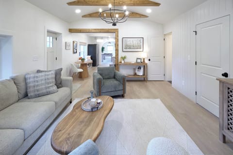 Family Room with exposed beams and TV