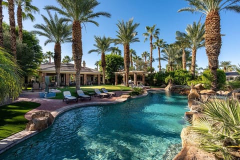 Backyard: pool & spa, large putting green, sun lounge chairs, natural gas fire-pit, outdoor kitchen area