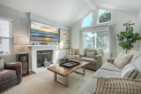 Cozy living room with fireplace and natural light