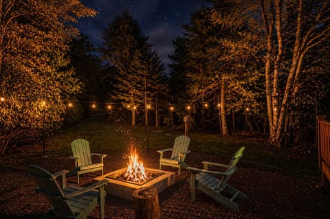 Backyard Fire Pit with Adirondack Chairs – Private Setting
