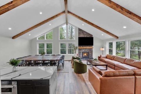 Spacious Open-Concept Living Room with Vaulted Ceilings & Natural Light