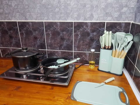 Kitchenette with 2 plate stove and cooking utensils