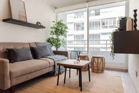 Relax in this cozy living area with a bright, airy ambiance and stylish decor, perfect for unwinding after exploring the city.