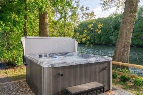 Soak your cares away in the riverside hot tub—perfectly placed on the patio for serene views and total relaxation after a day of adventure.