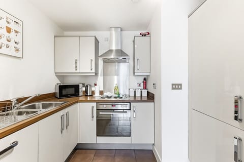 A modern, fully equipped kitchen complete with cookware, utensils, appliances, and essentials—everything you need to prepare and enjoy a home-cooked meal.