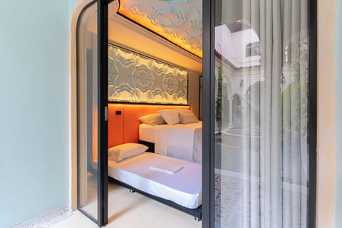Deluxe Quadruple Room, Ensuite, Courtyard View | Premium bedding, in-room safe, blackout drapes
