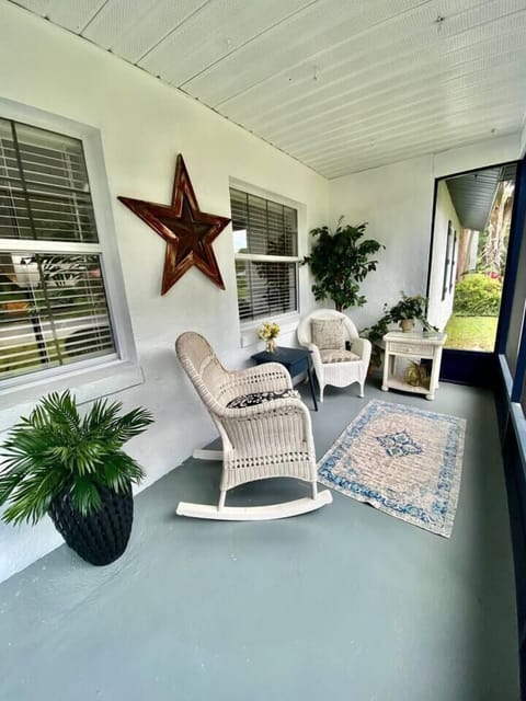 Enjoy the peace and quiet on the front screened porch.