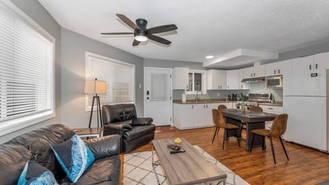 living room and kitchen table with full kitchen
