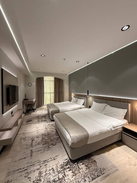 Luxury Twin Room, 1 Bedroom, City View | In-room safe, desk, laptop workspace, blackout drapes