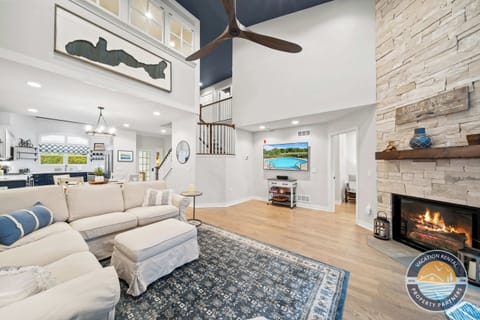 Bright entrance foyer with stylish decor and gleaming hardwood floors welcoming you into the home. Open sightlines to the living room create a spacious, flowing layout perfect for entertaining
