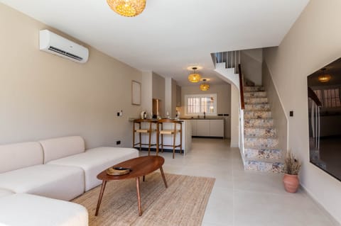 The spacious living room is nice and cozy.