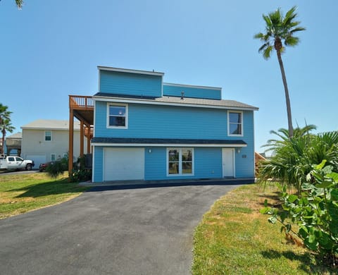 Charming blue beach house just steps from the shore!`