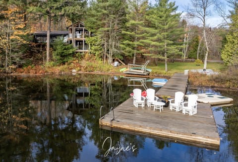Tranquil lakeside dock with cozy seating for sunset views