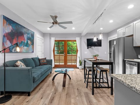 Bright modern living space with French doors and stylish kitchen
