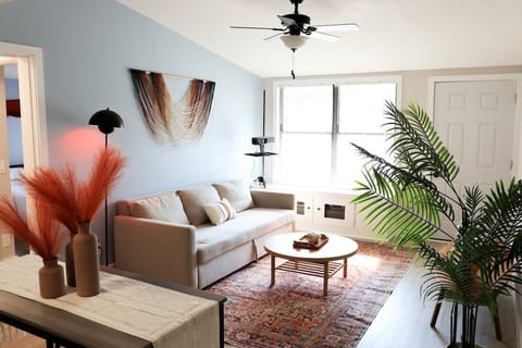 Airy living room with chic coastal décor and plenty of natural light.