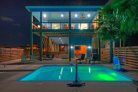 Rear view of the house with private pool and upper deck.