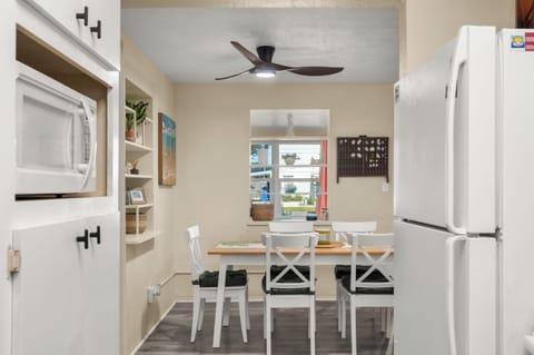 Dining area with built-in shelving and natural light