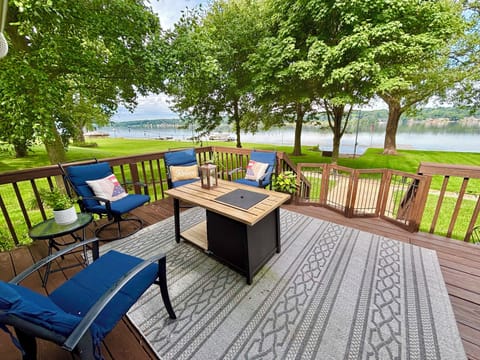 River view retreat deck, fire table, rocking chairs, outdoor dining and seating
