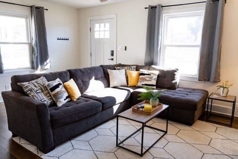 The main living area has plenty of seating and gobs of light.