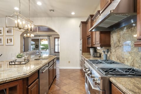 Well-appointed kitchen w/ stone counters, quality appliances & thoughtful details