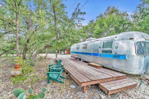 Airstream patio with chiminea and adirondacks for a private evening fire