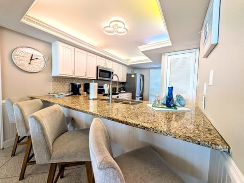 Spacious kitchen with granite island and cozy seating for gatherings