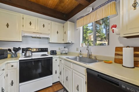 Everything you need including a lovely view over the sink, tea kettle, coffee maker, toaster and electric stovetop
