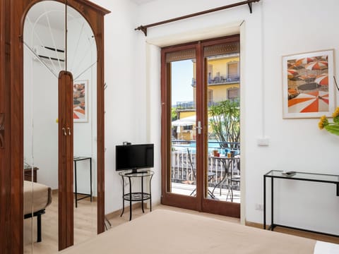 Comfort Apartment, Balcony, City View | Down comforters, desk, blackout drapes, soundproofing