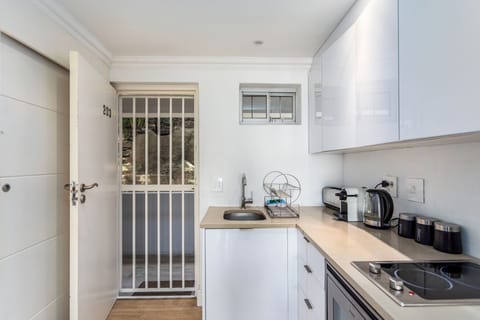 Deluxe Apartment, Balcony, Beach View | Private kitchen | Full-size fridge, microwave, oven, stovetop