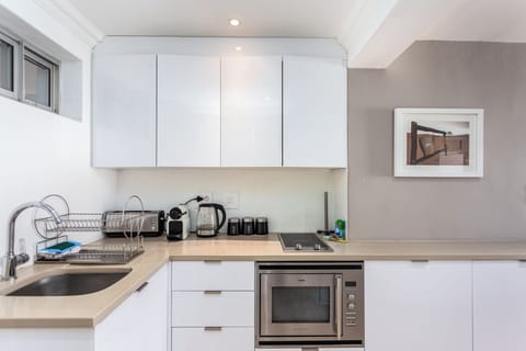 Deluxe Apartment, Balcony, Beach View | Private kitchen | Full-size fridge, microwave, oven, stovetop