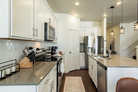 Kitchen with bar seating and modern finishes