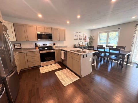 Fully equipped kitchen with granite countop and SS appliances.
