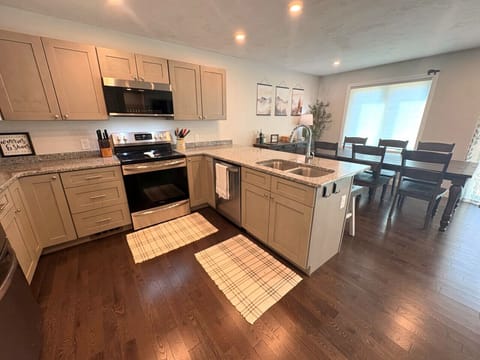 Fully equipped kitchen with granite countop and SS appliances.