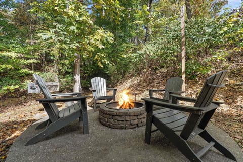 Your Fire Pit Retreat awaits! Gather around the fire with friends in this enchanting outdoor space!