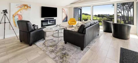 A stylish, airy living room with panoramic views right from the couch.