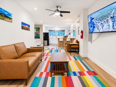 Open studio layout with a comfortable bed, kitchen, and relaxing seating area.