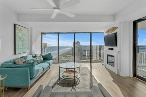 Relax in the comfort of a large well-appointed living room with an ocean view.