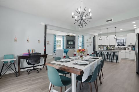 Modern Dining Room | Farmhouse Table with Contemporary Lighting | Cozy Space with Coffee Bar & Patio Access