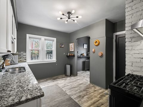 Bright kitchen angle showing ample cabinets & functional prep space 🥘✨🧺