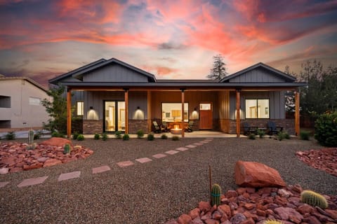 Front view of the home with stunning desert landscape