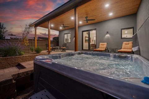 Bubbling hot tub off the back patio to unwind and relax