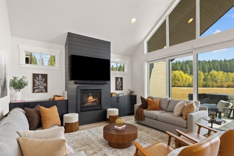 An elegant living room ideal for gathering and enjoying meadows views.