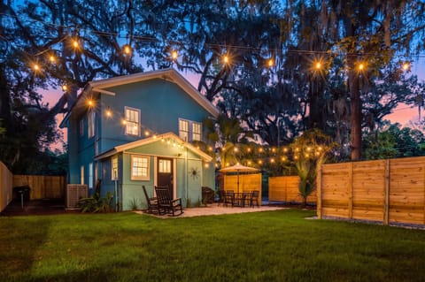 Backyard patio under string lights.