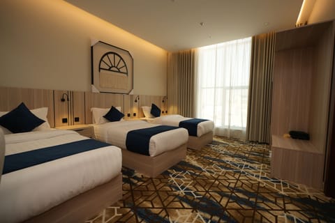 Junior Triple Room, City View | In-room safe, blackout drapes, iron/ironing board, free WiFi