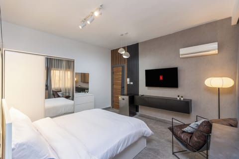 Apartment, Garden View | Minibar, iron/ironing board, free WiFi