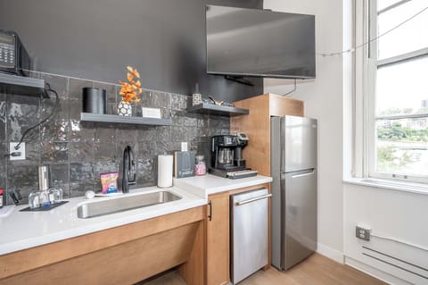 The sleek, open kitchen is equipped with all the comforts of home